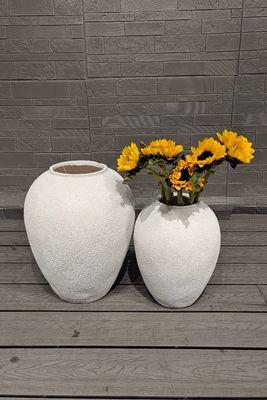 Drainage gaten in ronde vezel cement pot voor plantenliefhebbers